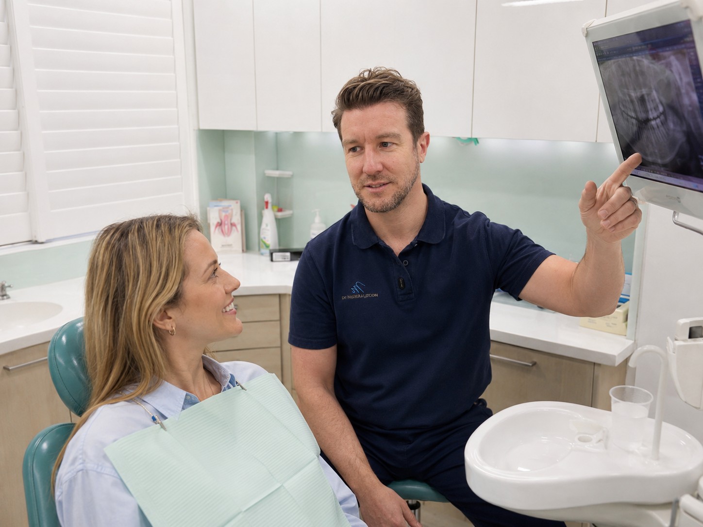 Dr Neil Lutton discussing digital treatment planning with a patient