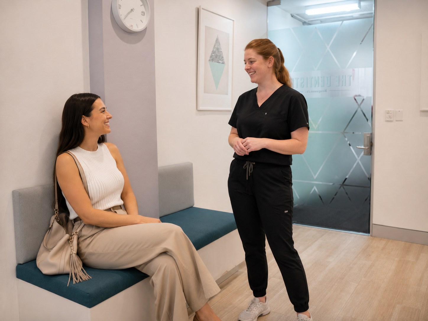 Patient speaking with a team member in The Dentistry waiting area